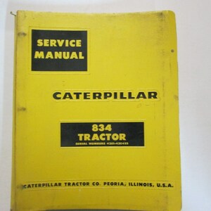 May include: Yellow service manual cover for a Caterpillar 834 tractor. The cover has black text that reads "SERVICE MANUAL", "CATERPILLAR", "834 TRACTOR", and "SERIAL NUMBERS 431-430-433". The bottom of the cover reads "CATERPILLAR TRACTOR CO. PEORIA, ILLINOIS, U.S.A."