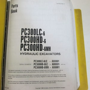 May include: A yellow and white parts book for Komatsu PC300LC-6, PC300HD-6, and PC300HD-6MH hydraulic excavators. The book lists serial numbers for each model.