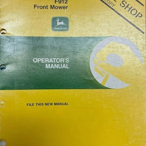 May include: A yellow and green John Deere F912 Front Mower Operator's Manual. The manual has the John Deere logo and the text "FILE THIS NEW MANUAL". The manual is a dealer service copy.