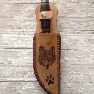 Hand tooled leather knife sheath with Wolf