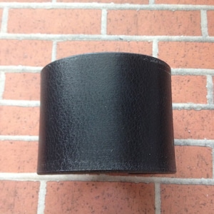 Black leather wrist band.