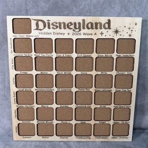 May include: Wooden Disneyland Hidden Disney 2026 Wave A board with multiple square spaces for collecting Disney-themed items. The board features various Disney characters and attractions, including Winnie-the-Pooh and the Matterhorn Bobsleds.