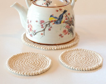 Set of hand crocheted cotton coasters - Set of cream coasters and a teapot pad