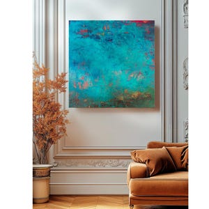 May include: An abstract square canvas art piece with a teal and turquoise colour palette, accented with red and copper tones. The artwork is mounted on a white wall above a brown sofa. A decorative plant in a gold pot is to the left.