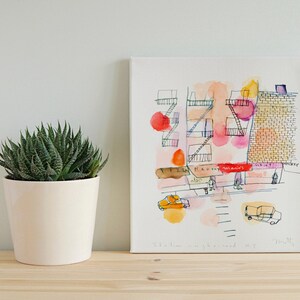 Minimalist living room with an A3 New York fine art building sketch print.
