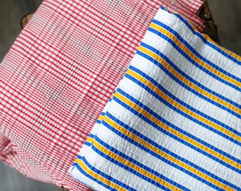 Vintage seersucker fabrics: Red, blue white plaid cotton synth blend / white w blue yellow stripes seersucker