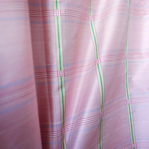 May include: Pink fabric with a checkered pattern in shades of pink, blue, green, and yellow.