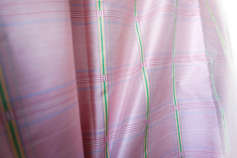 May include: Pink fabric with a checkered pattern in shades of pink, blue, green, and yellow.