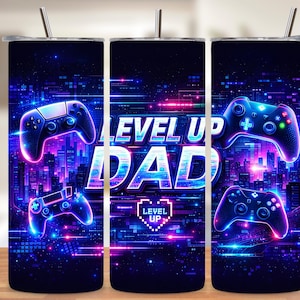 May include: A stainless steel tumbler with a vibrant design featuring the words "LEVEL UP DAD" in white and blue, along with neon-colored game controllers. The background showcases a futuristic cityscape with neon lights.