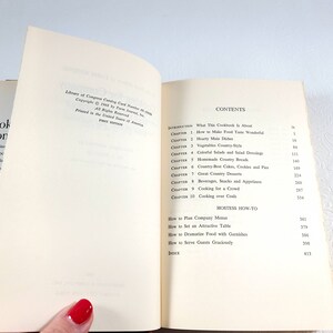 May include: Open cookbook with the title "Cookery, the Food Editor", showing the contents page and the introduction. The pages are off-white with black text. The book is open to reveal the table of contents.
