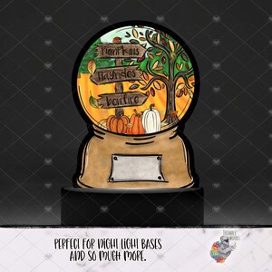 May include: A digital illustration of a snow globe with a fall theme. The snow globe features a tree with orange, yellow, and red leaves, pumpkins, and a sign that reads "Pumpkins, Hayrides, Bonfire".