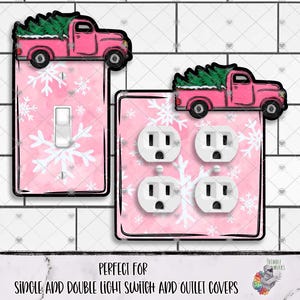 May include: Pink light switch and outlet covers with a snowflake design. Each cover has a pink truck carrying a green Christmas tree. The text at the bottom reads "Perfect for single and double light switch and outlet covers."