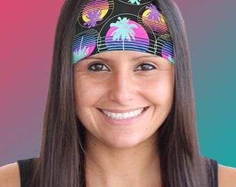May include: A black headband with a colorful retro pattern of palm trees and sunsets. The headband is made of a stretchy material and is perfect for keeping hair out of your face.