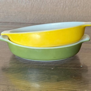 May include: A set of three ceramic mugs with a speckled, matte finish. The mugs are in shades of cream, light gray, and dark gray. Each mug has a simple, minimalist design, perfect for coffee or tea.