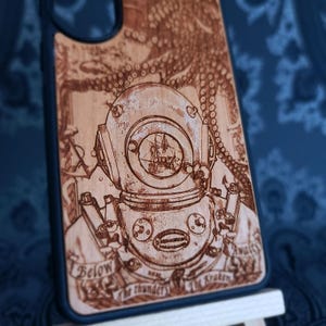 Octopus wood case for iPhone 17 Pro Max featuring a vintage diving helmet and sailing ship