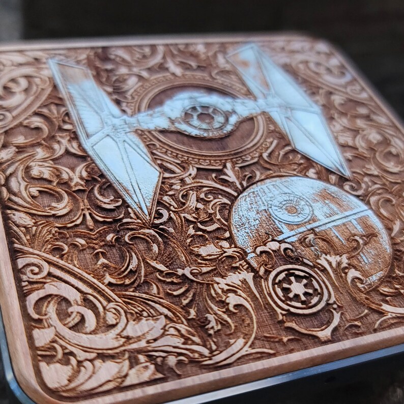 Laser-engraved wood wireless charger featuring a galactic spacecraft and celestial design. Fast 15W Qi charging for iPhone 16, Galaxy S25 & all Qi-enabled phones.