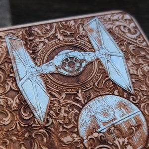 Laser-engraved wood wireless charger featuring a galactic spacecraft and celestial design. Fast 15W Qi charging for iPhone 16, Galaxy S25 & all Qi-enabled phones.