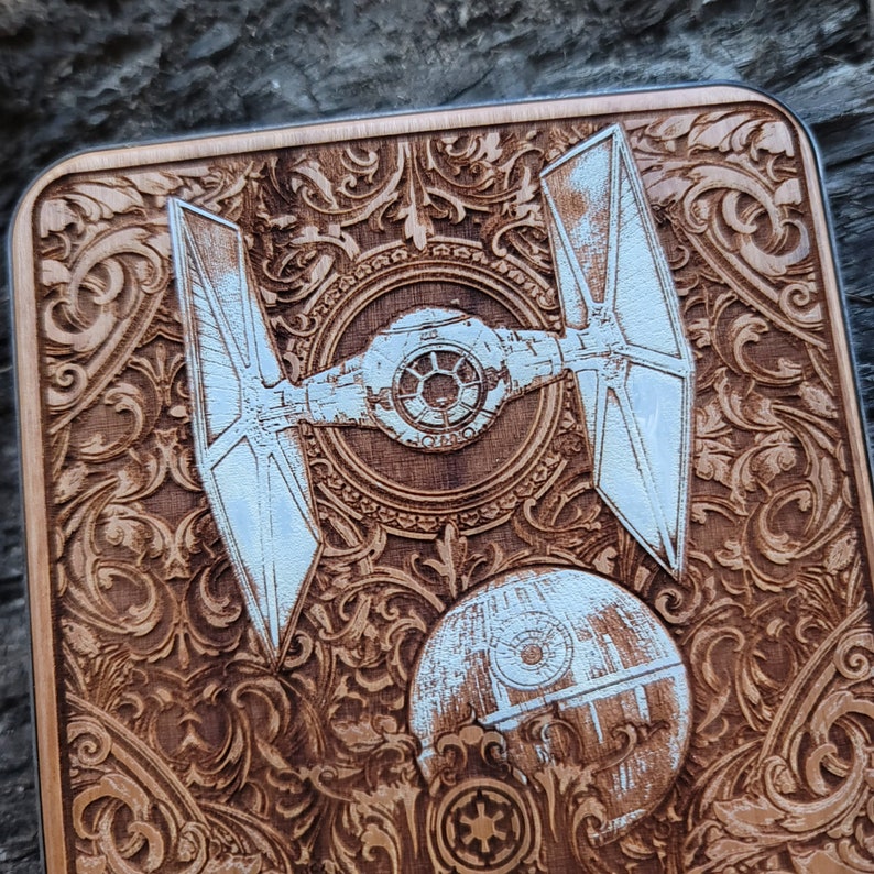 Laser-engraved wood wireless charger featuring a galactic spacecraft and celestial design. Fast 15W Qi charging for iPhone 16, Galaxy S25 & all Qi-enabled phones.