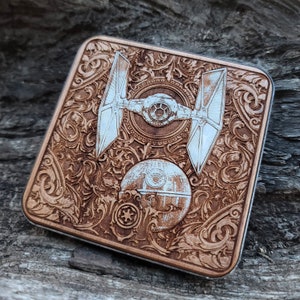 Laser-engraved wood wireless charger featuring a galactic spacecraft and celestial design. Fast 15W Qi charging for iPhone 16, Galaxy S25 & all Qi-enabled phones.