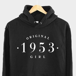 May include: Black hooded sweatshirt with white text that reads "ORIGINAL . 1953 . GIRL"