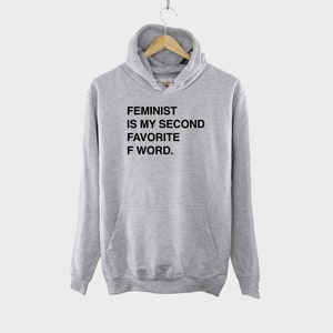 May include: A gray hooded sweatshirt with the text "FEMINIST IS MY SECOND FAVORITE F WORD." printed on the front.