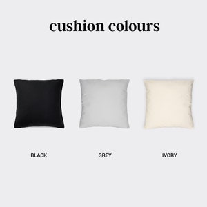 May include: Three square throw pillows in black, grey, and ivory. The pillows are arranged in a row from left to right. The text "cushion colours" is above the pillows.