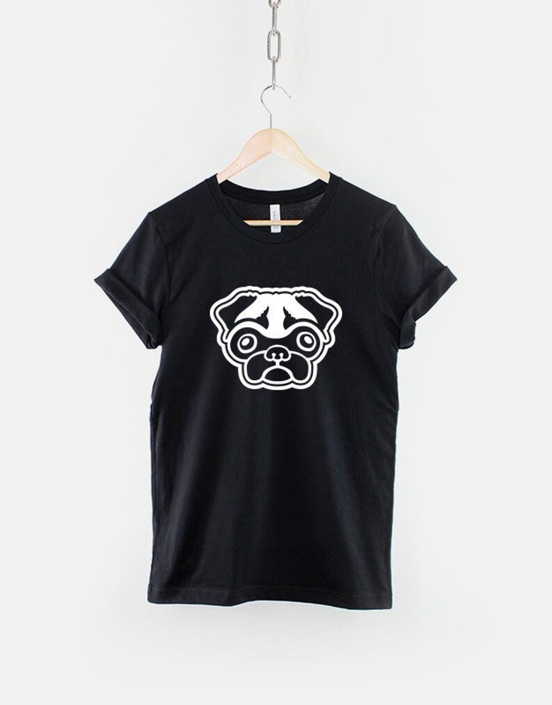 May include: Black t-shirt with a white pug face graphic.