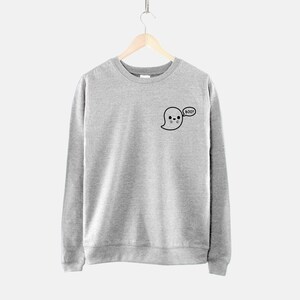 May include: A gray sweatshirt with a black ghost graphic and the text "BOO!" on the front.