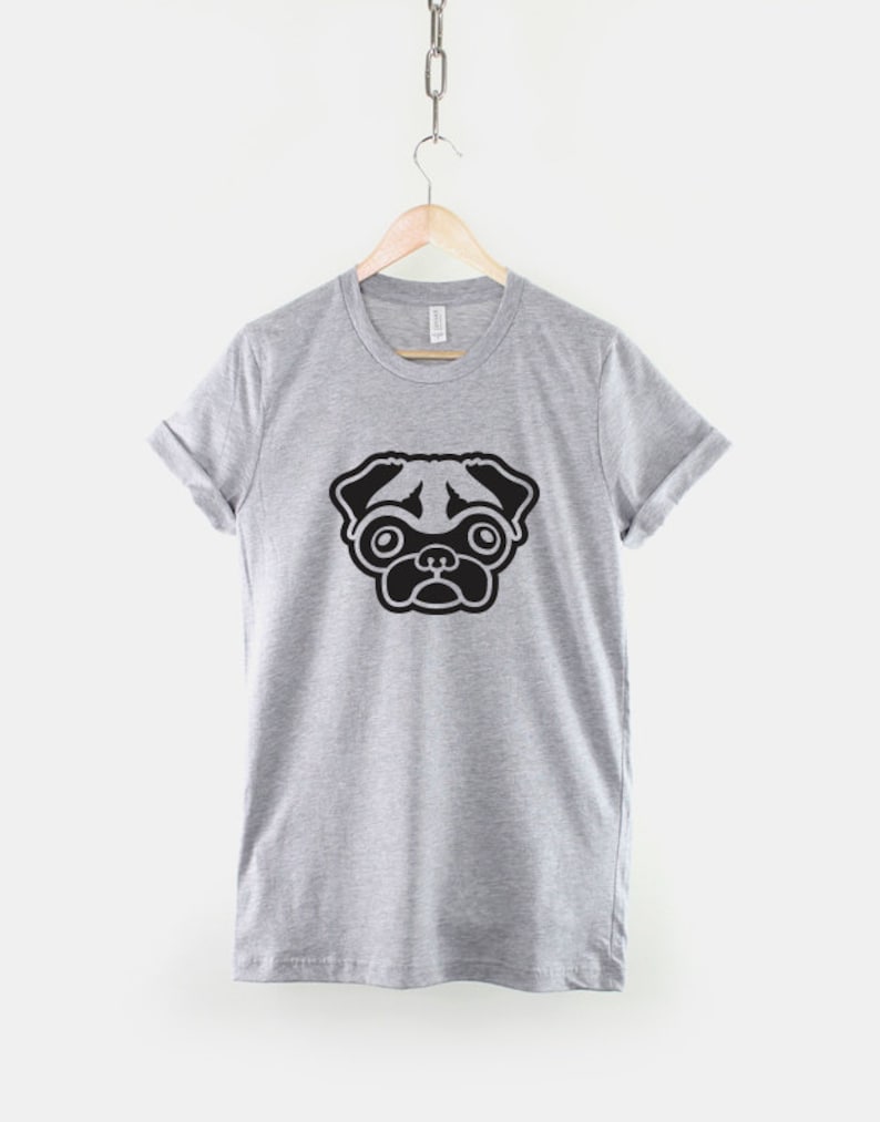 May include: A gray t-shirt with a black pug illustration on the front.