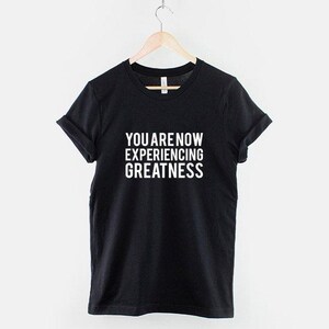 Greatness Slogan – Cotton Tee: Urban Streetwear, Soft Unisex Shirt image 1