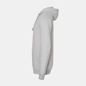 May include: A gray hooded sweatshirt with a pouch pocket on the front.