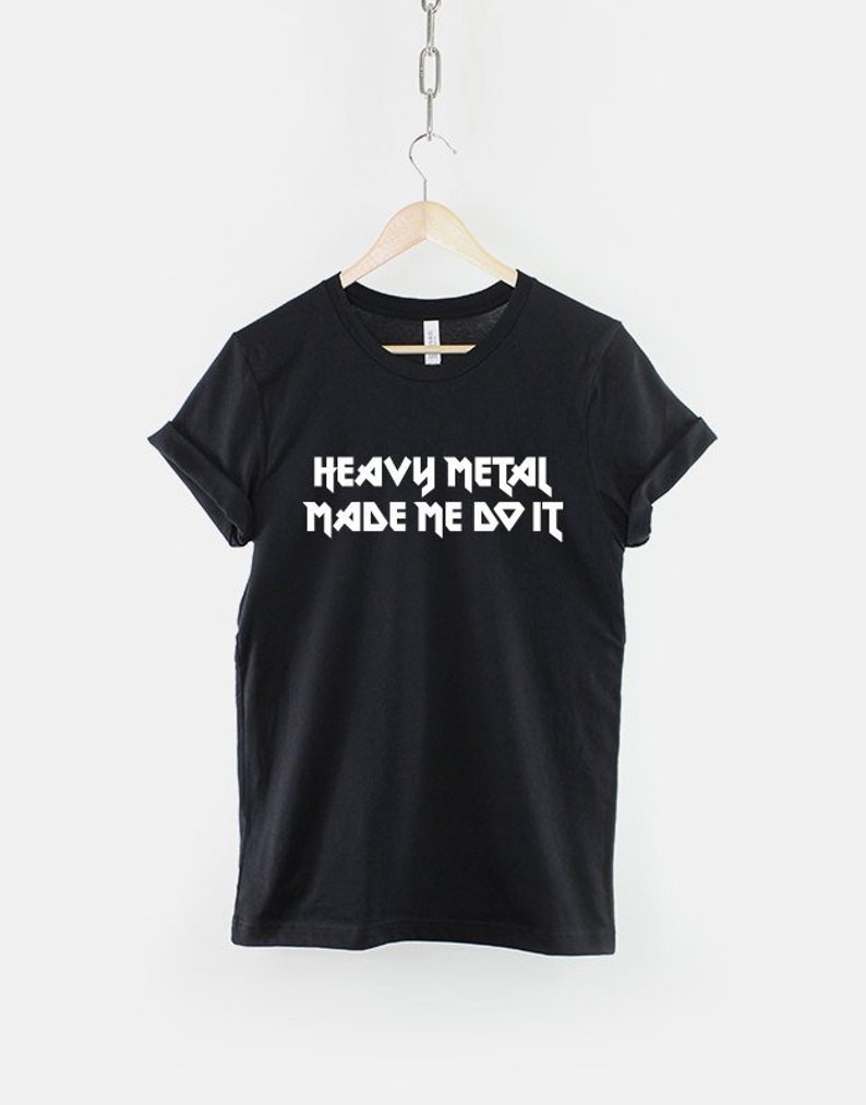 May include: Black t-shirt with white text that reads "Heavy Metal Made Me Do It".