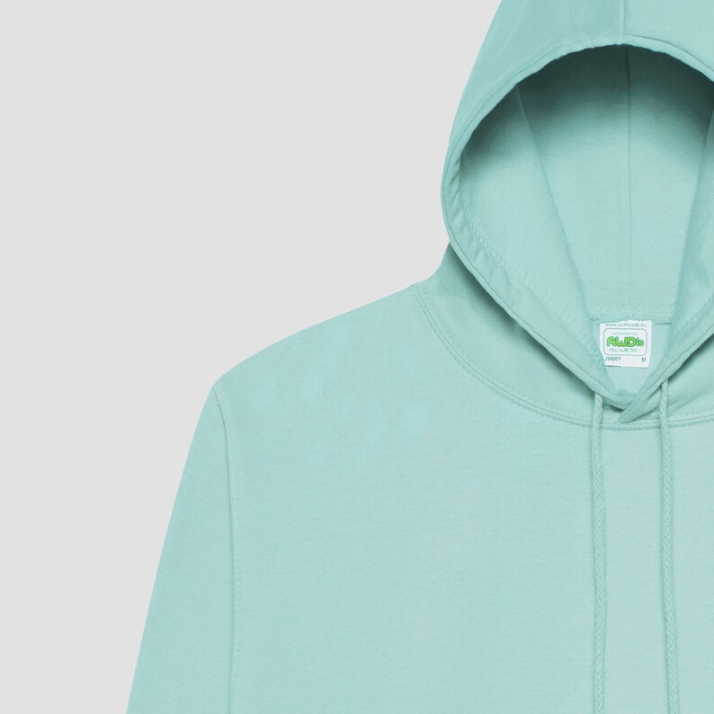 May include: A light blue hooded sweatshirt with a green label that says "Fruit of the Loom" on the front.