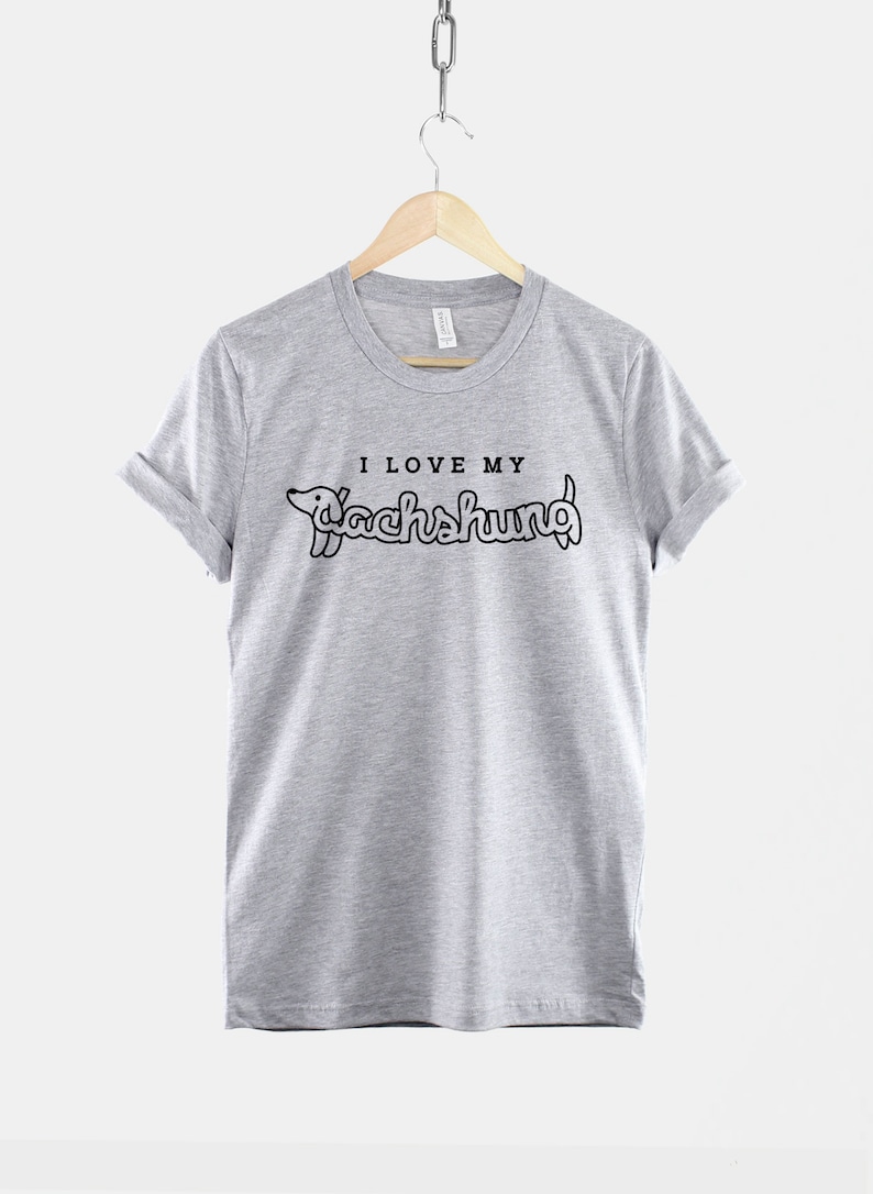 May include: A heather grey t-shirt with a black graphic of a dachshund and the text "I love my dachshund".
