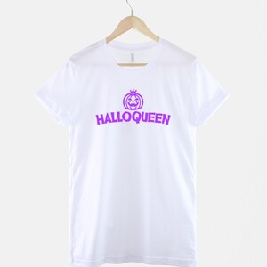 Peut inclure: T-shirt blanc avec un graphique de citrouille violet et le texte "Halloqueen" imprim&eacute; sur le devant.