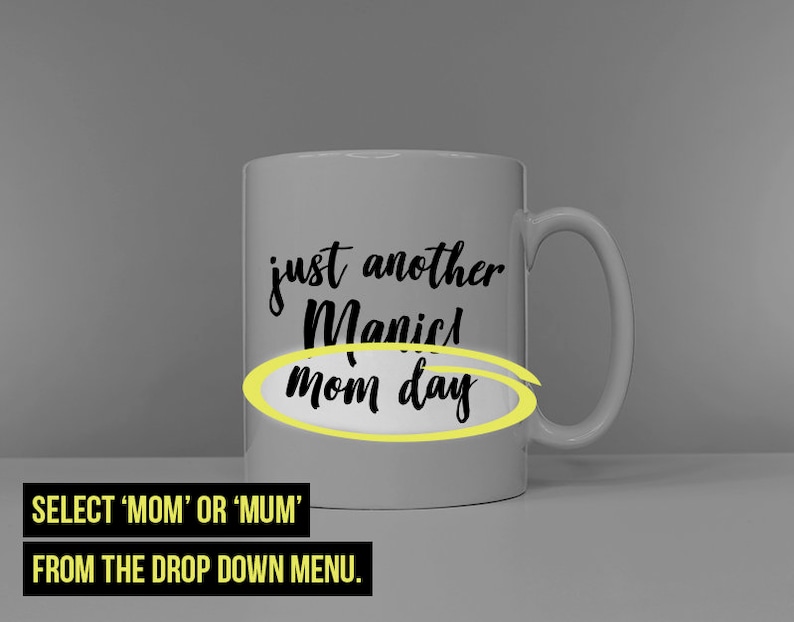 May include: White ceramic mug with black text that reads "just another manic mom day" with the word "mom" circled in yellow.