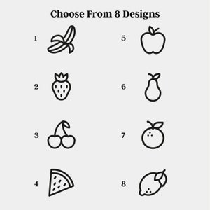 May include: A set of eight black and white line drawings of different fruits. The fruits are numbered 1 through 8. The fruits are: banana, strawberry, cherries, watermelon slice, apple, pear, orange, and lemon.