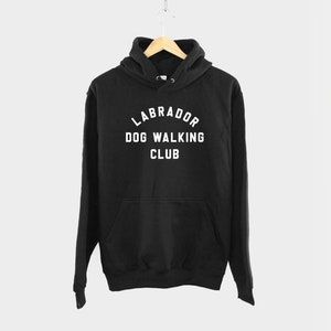 May include: Black hooded sweatshirt with the text "Labrador Dog Walking Club" in white.