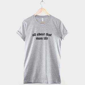 May include: Gray t-shirt with black text that reads "all about that mom life".