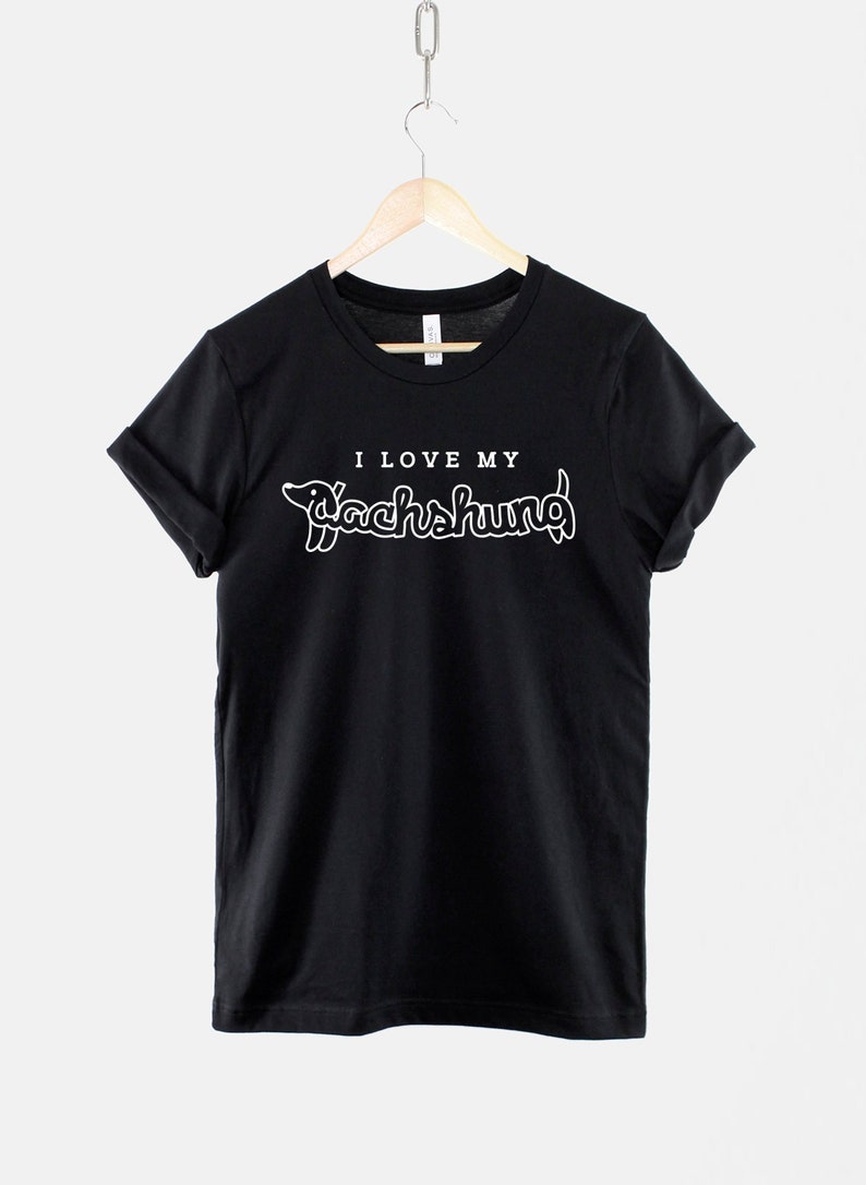 May include: Black t-shirt with white text that says "I love my Dachshund" with a dachshund silhouette.