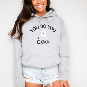May include: A gray hoodie with the text "You do you boo" and a small ghost graphic.