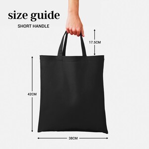 May include: Black tote bag with short handles. The bag measures 17.5 inches tall, 15 inches wide, and 16.5 inches deep.