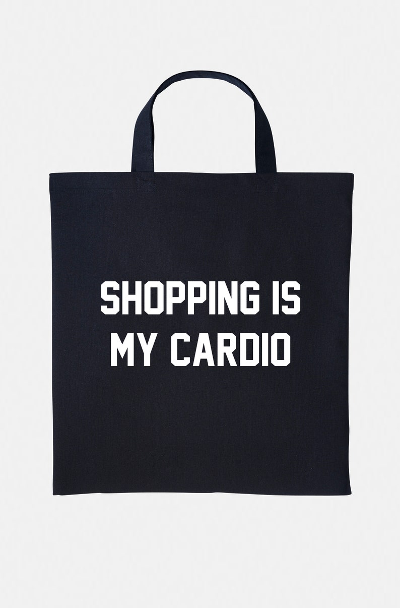 May include: Black canvas tote bag with white text that reads "Shopping is my cardio."