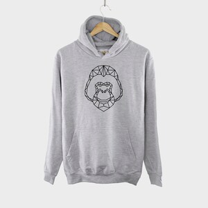 May include: A gray hooded sweatshirt with a black geometric design of a gorilla on the front.