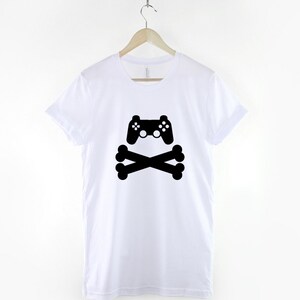 May include: White t-shirt with a black graphic of a video game controller and crossed bones.