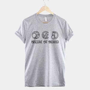 OCD Cat Shirt Playful Tee: Funny Obsessive Cat Humor, Lightweight Cotton (Unisex Sizes XS-2XL, Durable Print) image 2