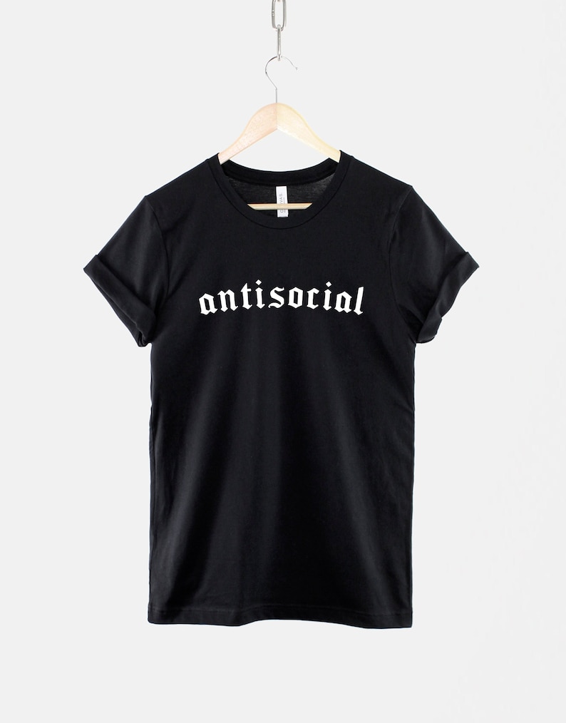 May include: Black t-shirt with the word "antisocial" printed in white gothic font.