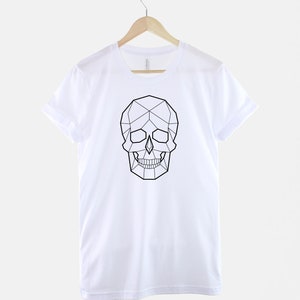 May include: White t-shirt with a black geometric skull design.