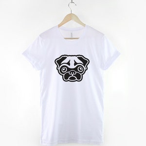May include: White t-shirt with a black and white pug illustration on the front.