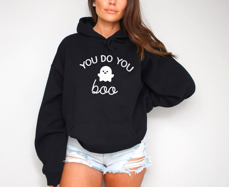 May include: Black hooded sweatshirt with a white ghost graphic and the text "You do you boo".